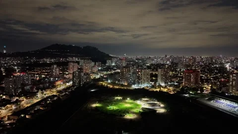 Aerial night hyperlapse orbiting over dark terrain with the bright illumina.. Stock Footage 339210385
