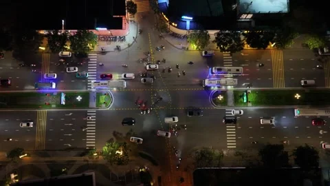 Aerial Night Intersection With Steady Car And Bus Movement, Neon Storefronts Stock Footage 340332935