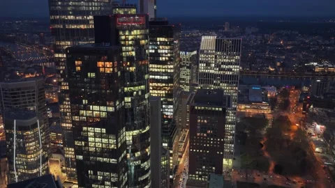 Aerial night shot orbiting illuminated office buildings in financial district of Vídeos de archivo 324056950