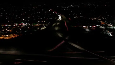 Aerial night time lapse of freeway traffic 스톡 동영상 243613436