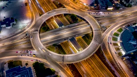 Aerial night time lapse view of multilevel junction highway interchange Stock Footage 263656989