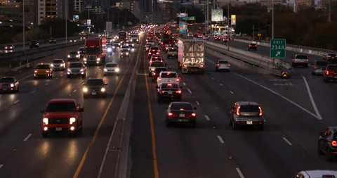 Aerial night time view busy highway interstate 35 rush hour drive-time traffic Stock Footage 146051124