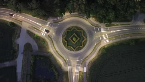 Aerial Night Top‑Down View of Illuminated Roundabout – 4K ProRes Stock Footage 337534214