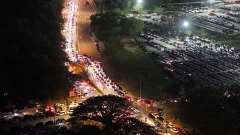 Aerial night traffic light trails along parking lot Stock-Footage 337984741