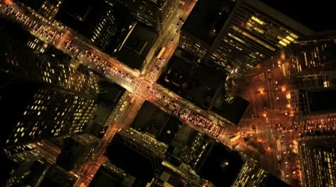 Aerial night vertical view of skyscraper rooftops, USA Stock Footage