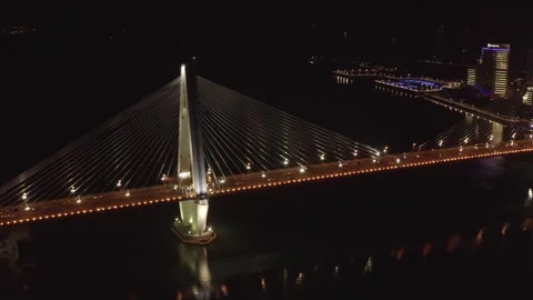 Aerial Night View of Cable-Stayed Bridge Over River in Haikou China Stock Footage 341699032
