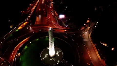 Aerial night view of congested urban interchange with heavy traffic queues on Stock Footage 343948630