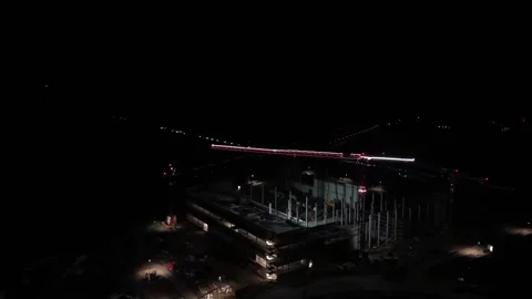 Aerial night view of construction site in United States with illuminated cranes 動画素材 332728636