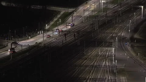 Aerial Night View of Electric Train Railway Tracks and Active Transport Vídeo Stock 325716682