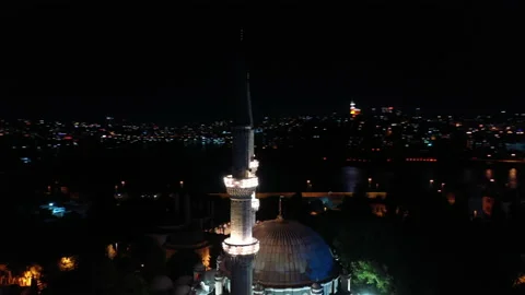 Aerial night view of Eyup Sultan Mosque. There says "Alms is purified." Video stock 135515032