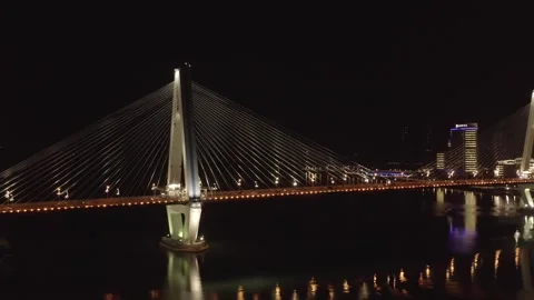 Aerial Night View of Illuminated Cable-Stayed Bridge in Haikou, Hainan, China Stock Footage 341698368