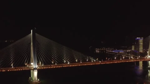 Aerial Night View of Illuminated Cable-Stayed Bridge in Haikou, China Stock Footage 341699596