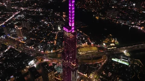 Aerial night view of landmark skyscraper in ho chi minh city, vietnam, with.. Video stock 335015315