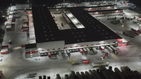 Aerial Night View of Large Logistics Distribution Center with Multiple Loading Stock Footage 326022371