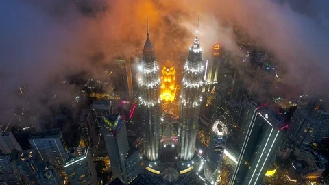 Aerial night view with low clouds at KLCC Tower and cityscape of Kuala Lumpur. Stock Footage 101431061