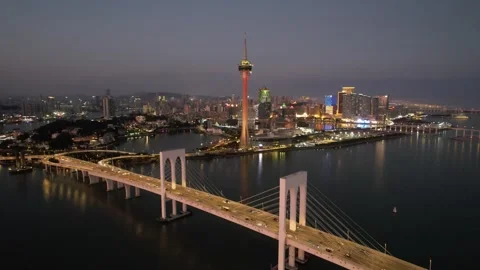 Aerial night view of the Macau Tower and Sai Van Bridge city scenery Stock Footage 346686837