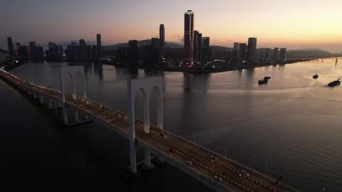 Aerial night view of the Macau Tower and Sai Van Bridge city scenery Stock Footage 346687101