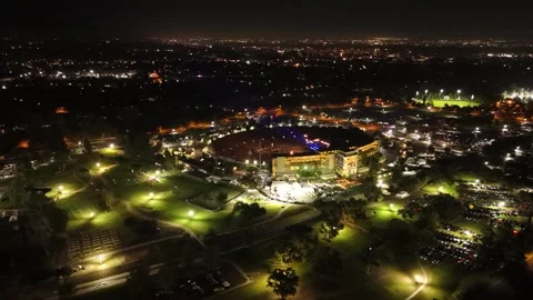 Aerial Night View of Packed Rose Bowl Stadium and Pasadena City Lights Stock Footage 341898722