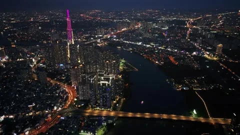 Aerial Night View of Saigon Skyline and Landmark 81 by the River Stock Footage 340973306