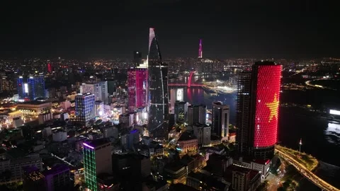 Aerial night view of skyline of ho chi minh city by saigon river vietnam 스톡 동영상 311861653