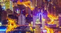 Aerial night view of skyscraper and illuminated streets in a modern city HD Footage
