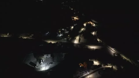 Aerial night view of small town streets illuminated by winter lights Stock Footage 341765990