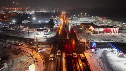 Aerial night view of snowy intersection in Lancaster,PA with traffic lights Stock Footage 333329003