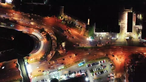 Aerial Night View of Urban Intersection, Traffic, and Parking Lots Video stock 295750729