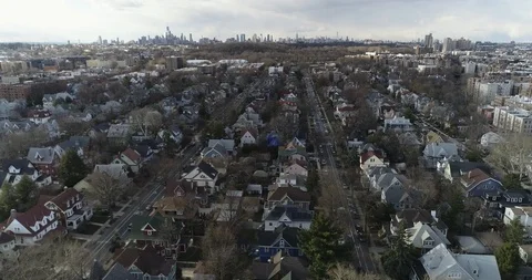 Aerial of NYC Skyline and Residential Area in Queens, New York Fall brown Stock Footage