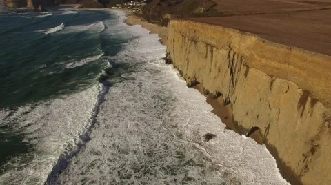 Aerial of Ocean and Sandy Cliffs Stock Footage 68380671