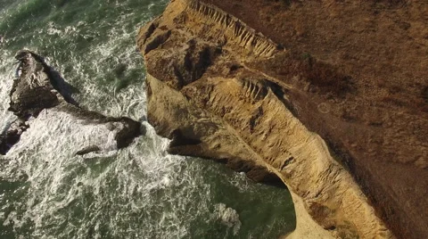Aerial of Ocean and Sandy Cliffs Stock Footage 68381533