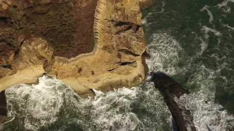 Aerial of Ocean and Sandy Cliffs Stock Footage 68381542