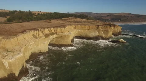 Aerial of Ocean and Sandy Cliffs Stock Footage 68381773