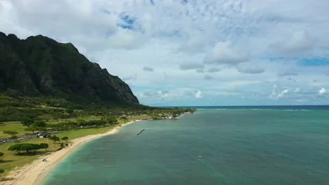 Aerial of ocean, beach, cliffs and kayaker, Hawaii, 4k Stock Footage 179647886