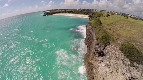Aerial Of Ocean, Beach, Waves, Coconut Trees &amp; Cliff In Barbados - Pulling Away Stock Footage 45312155