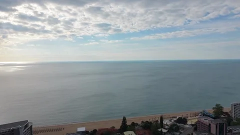 Aerial Ocean Horizon Beneath Dramatic Cloudy Sky During Peaceful Daytime Flight Видео 334919308