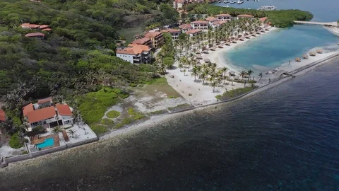 Aerial from ocean over Parrot Tree Plantation and Beach Resort, Roatan Video stock 122090488