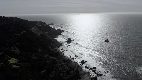 Aerial of ocean at sunset facing the sun, 4K Stock Footage 106954960