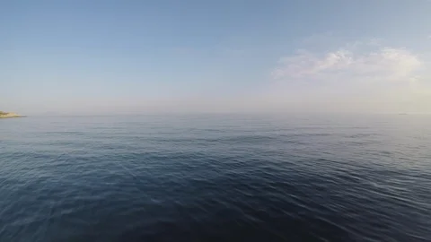 Aerial: Ocean at sunset Stock Footage 89324682