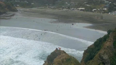 Aerial: Ocean surf and cliffs. Piha, New Zealand Stock Footage 132387465