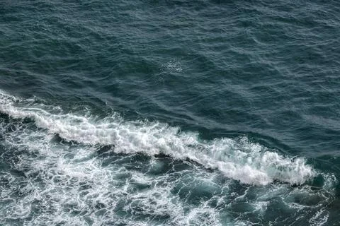 Aerial ocean view showcasing waves breaking along the coast Stock Photos