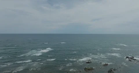 Aerial Ocean Waves and Rocky Coast Stock Footage 252677458