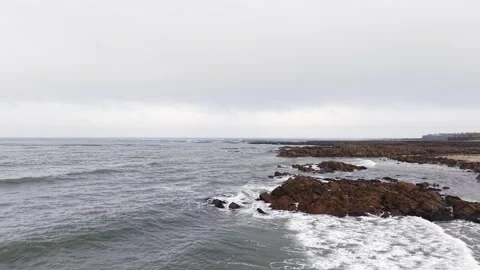 Aerial ocean waves hitting rocky coast in Scotland Video stock 333148209