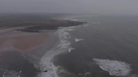Aerial ocean waves hitting sandy beach in Scotland Video stock 333148206
