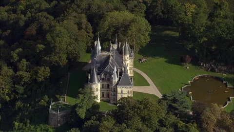 Aerial of old castle surrounded by forest, Chateau De Boursault Stock Footage 108594257