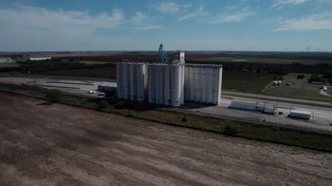 Aerial of old concrete grain elevators in farm country Stock Footage 319765098