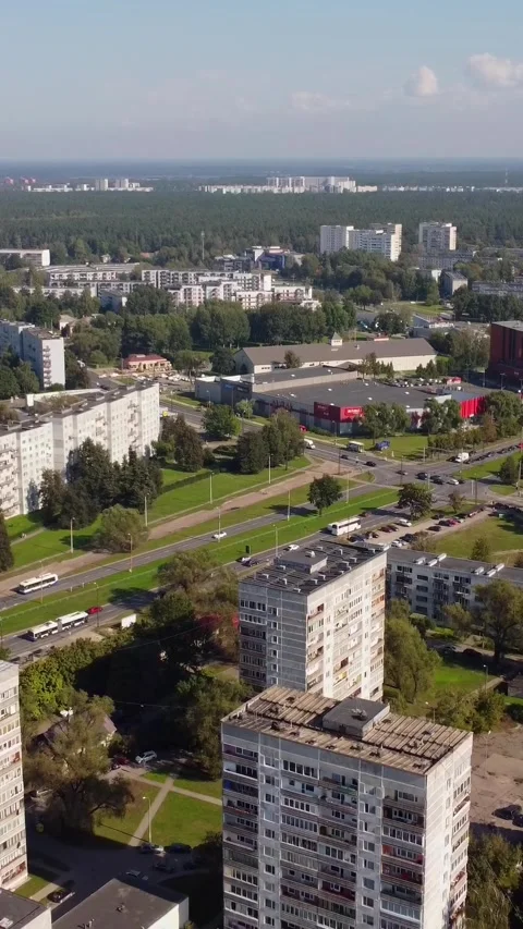 Aerial of old outdated Soviet style apartment blocks and roads in suburban city 库存影片 308439198