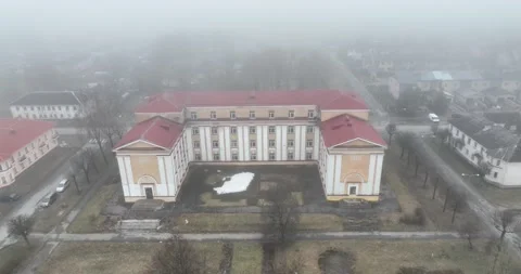 Aerial. Old soviet school building in a town near the border with Russia. Fog. Vídeos de archivo 188518520