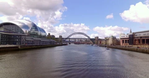Aerial from old tyne bridge moving throught opened Gateshead Millenium Bridge Stock Footage 159157992