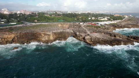 Aerial opening of Boca do Inferno, Hell's mouth cliff in Cascais, Portugal Stock Footage 220865025